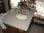 Loaf of fresh bread for baking (under green wrap) and some bread rising for FRIED BREAD. Yummm!!!  Oh, can't forget the rhubarb pie under the foil!