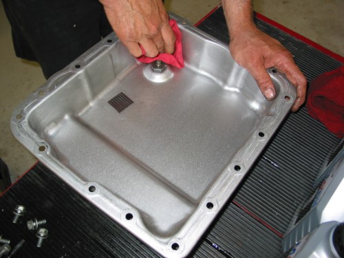 Complete the clean-up by wiping out the inside of the pan with a rag.  You'll want to clean the magnet as well and make sure it gets put back in the pan when complete!  In many cases, these magnets can be removed and cleaned (they aren't "glued" in place) so don't forget to reinstall it!