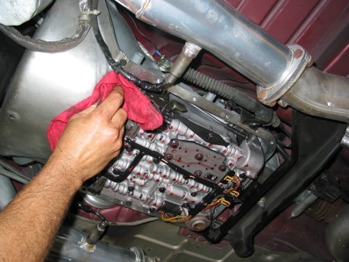 Wipe the oil off the sealing surface and do another quick inspection to make sure all gasket material or sealant (if previously used) are removed.  It's better to spend a little extra time here than to have to remove the pan again later down the road because you have a leak!