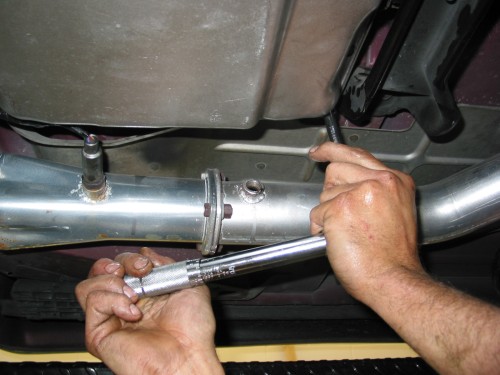 Torquing the bolts to 120 in/lbs.  If you're not doing a 4L60E transmission fluid change, your torque specs may be slightly different.