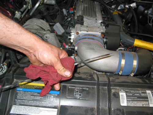 After you have added the correct amount of fluid, you'll want to check it!  Start the car up and go through the gears a couple of times.  Leave the car running and in Park and check the dipstick for proper level.