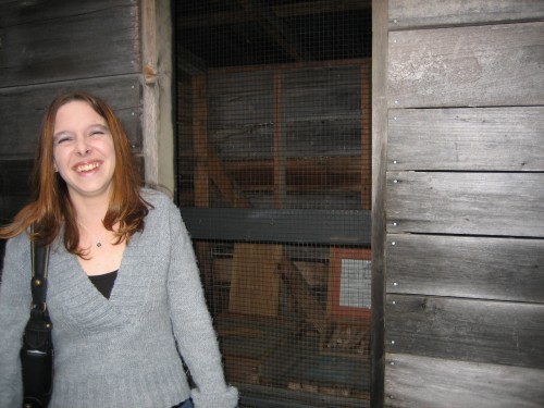 SHEILA AT THE OUTHOUSE.JPG