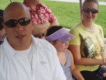Uncle Bobbie and Natasha riding on the tram to Animal Kingdom.