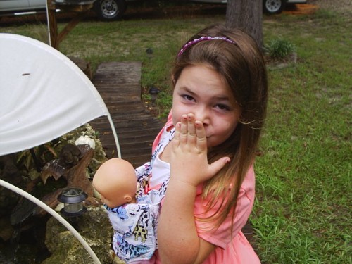 Hi Mommy and Daddy - here is a kiss for you and my sisters.