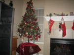 OUR TREE WITH STOCKINGS ON MANTEL