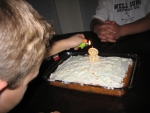 Faren lighting his 8th birthday candle